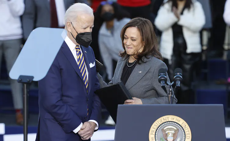 Joe Biden wearing a COVID mask is greeted by the vice-president, Kamala Harris, before making a speech at Clark Atlanta University and Morehouse College in Atlanta, Georgia