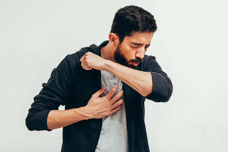 A man coughing