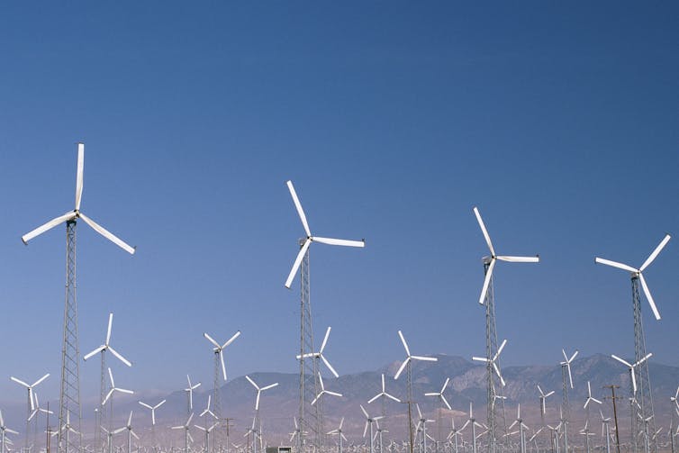 Countless wind turbines in a desert.