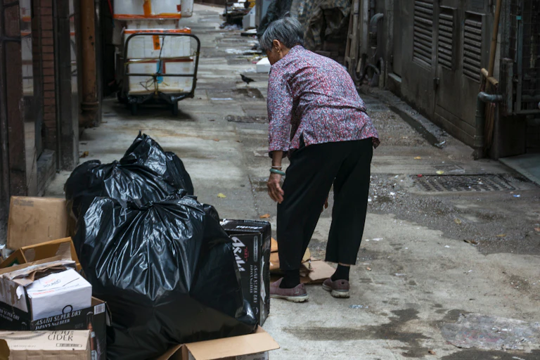 Woman working outside in an alley