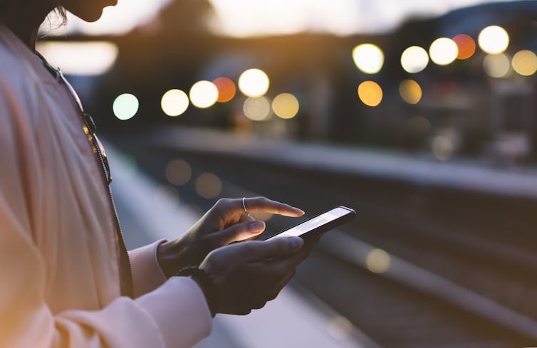 A person using their mobile phone.