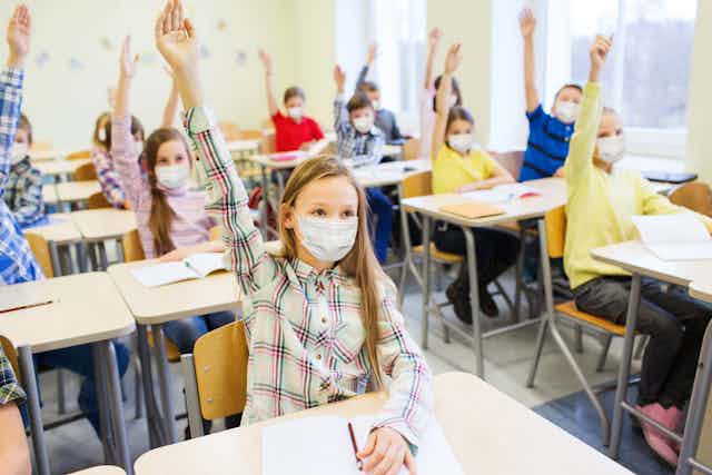 masked children in classroom
