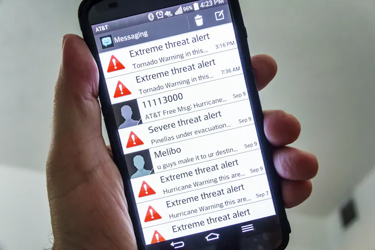 A phone with six tornado warning texts.