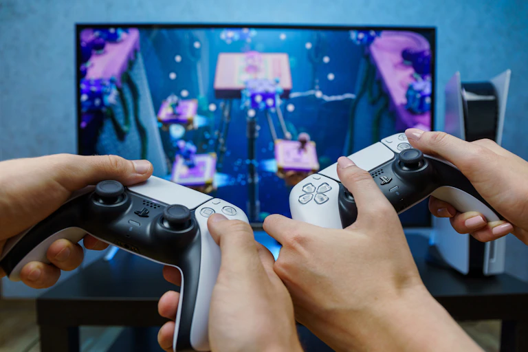 Two gamers playing on a PS5
