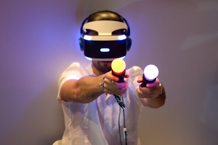 Gamer trying out a PlayStation VR headset