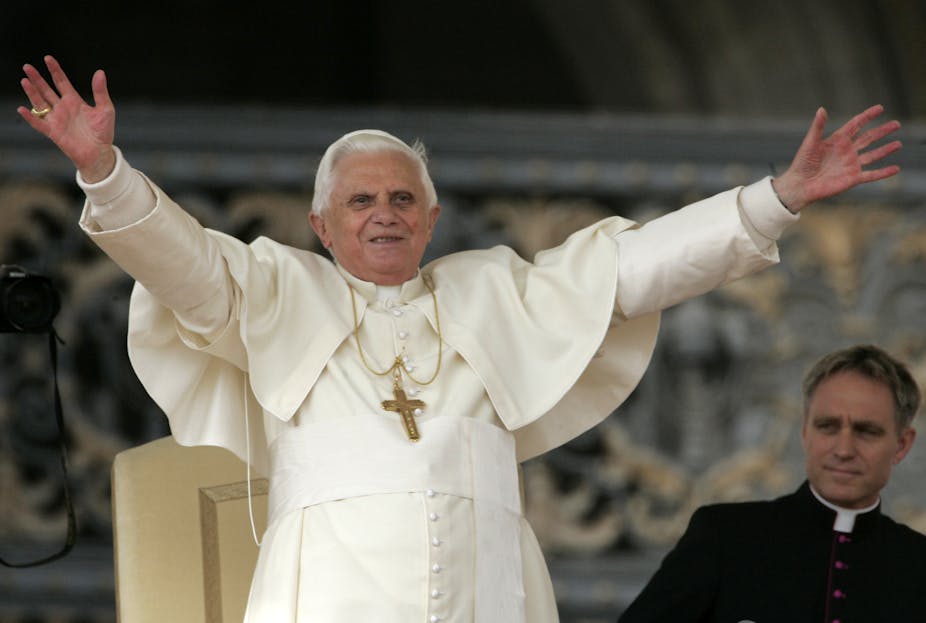 Pope Benedict XVI waves to a crowd.