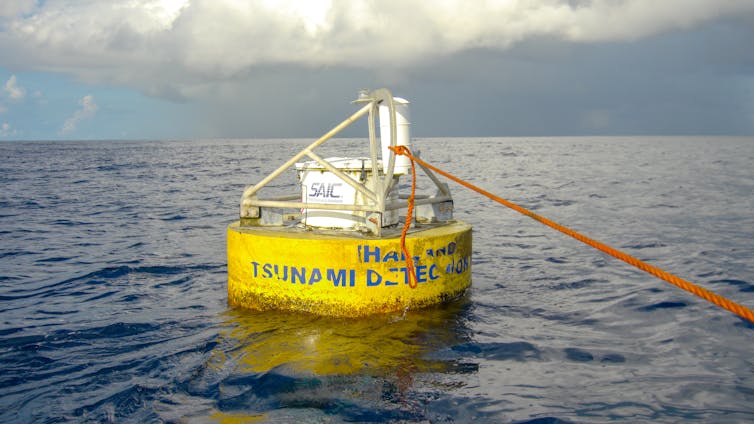 A yellow buoy in the ocean