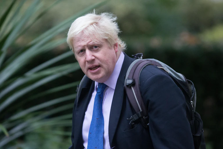 Boris Johnson wearing a rucksack