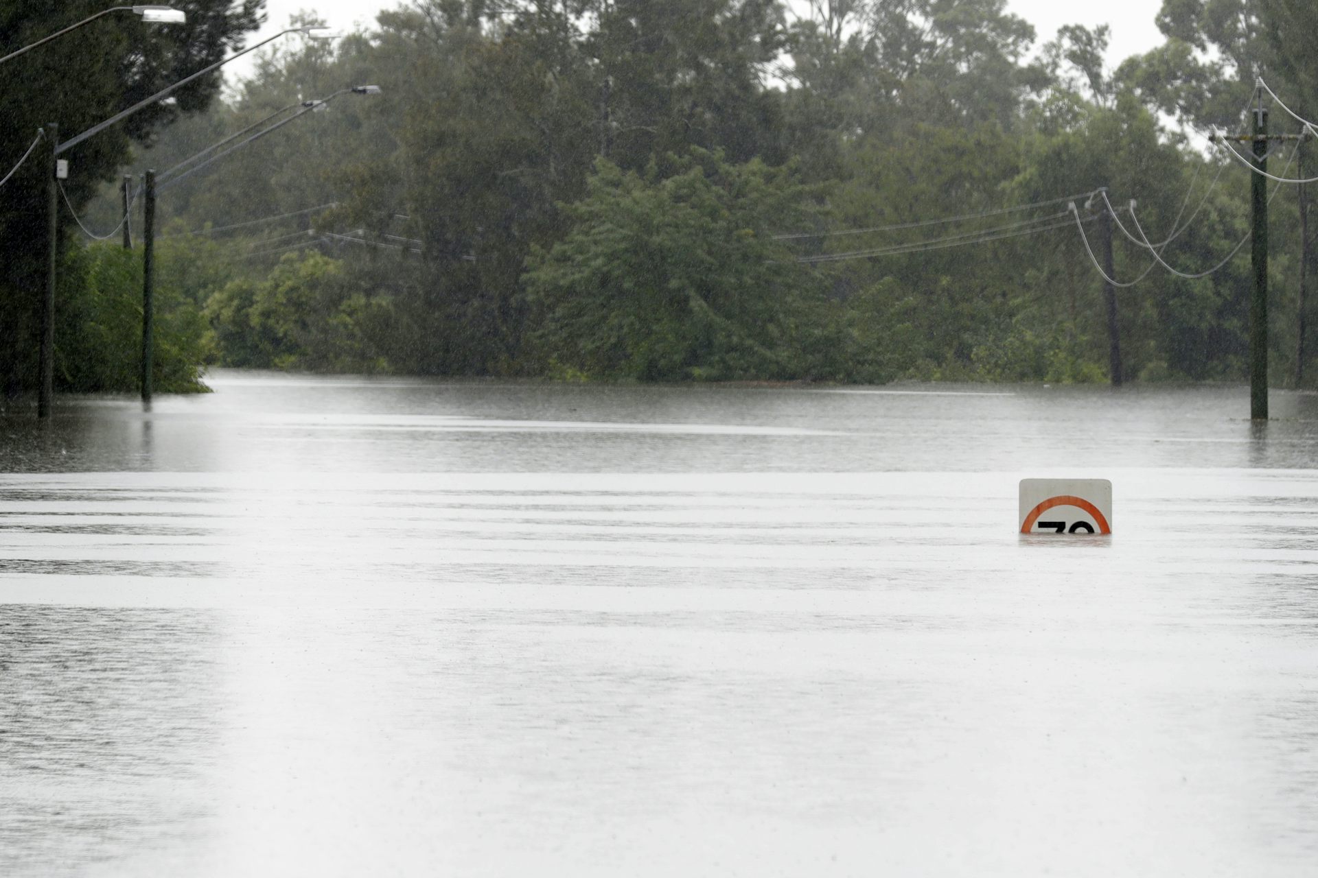 Speed sign in floodwaters