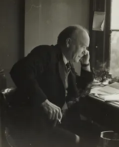 William Astbury working at a desk.