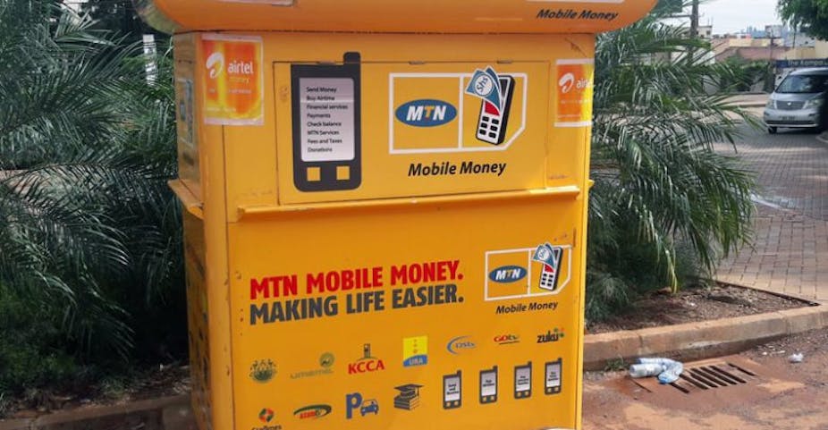 A yellow metal stall with inscriptions and the image of a mobile phone