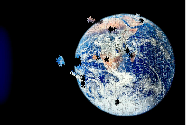An image of Earth as a jigsaw puzzle with pieces floating into place.