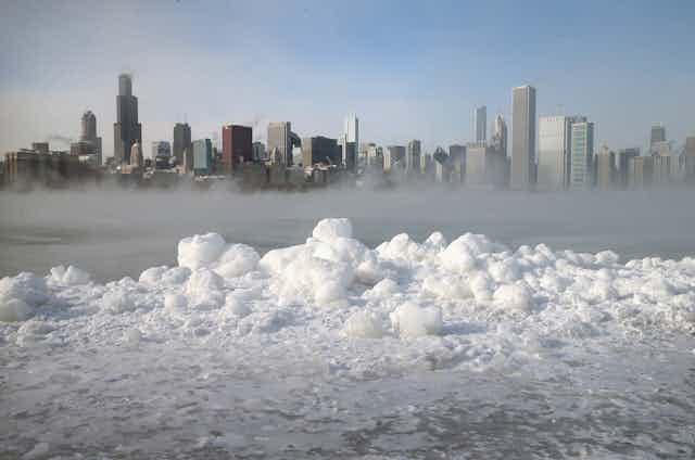 View of Chicago across Lake Michigan with mist hanging over the water