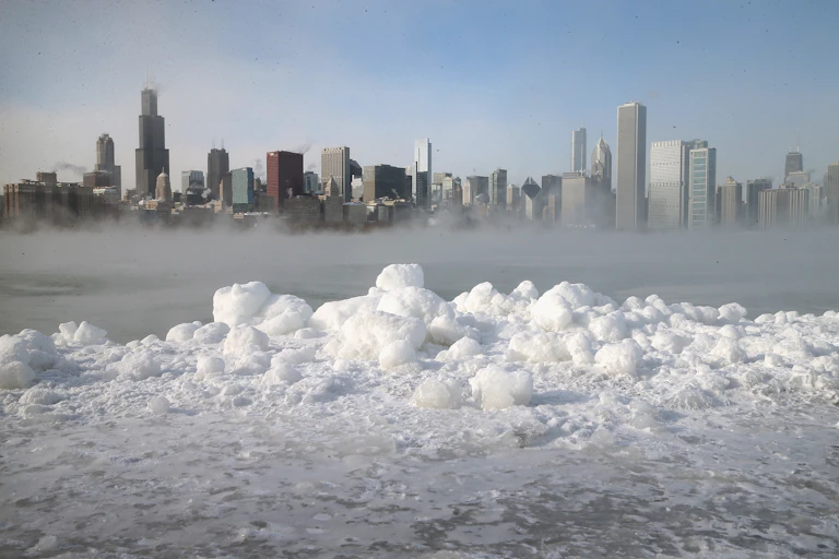 View of Chicago across Lake Michigan with mist hanging over the water