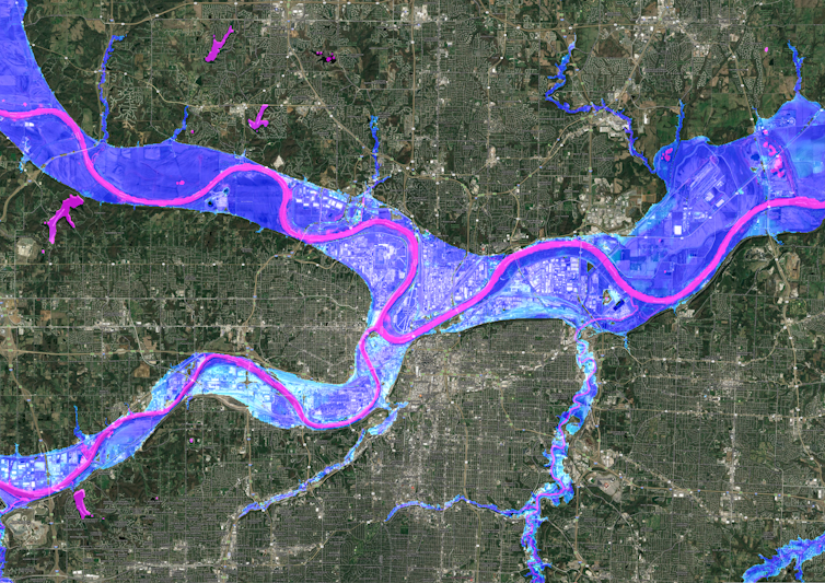 A satellite image of Kansas City showing flood risk overlaid along the rivers.