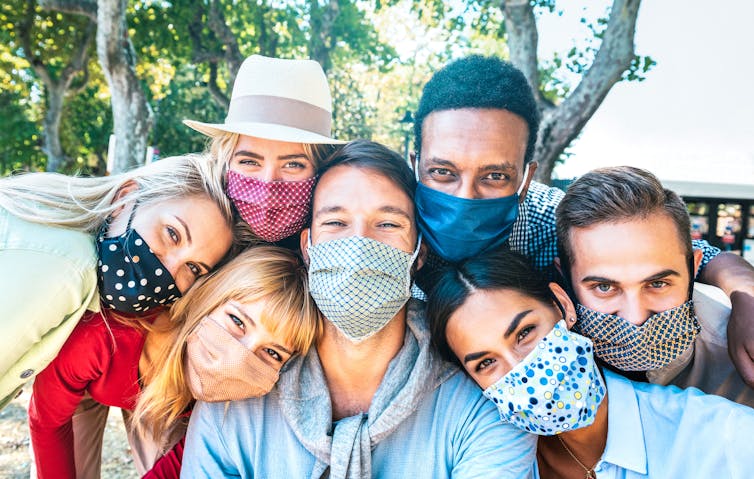 Group of friends wearing masks