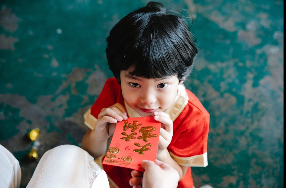 Child receives a red envelope.