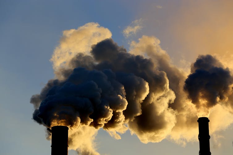 steam billows from coal stacks