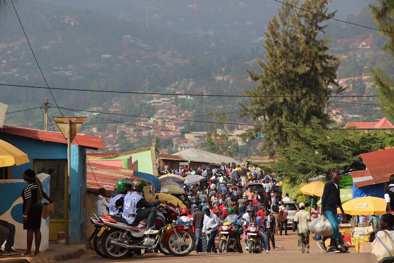 Crowded street with people, bikes and markets