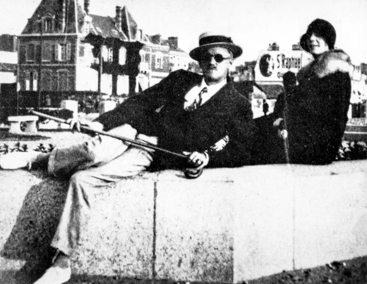 Man and woman pose for camera in 1930.