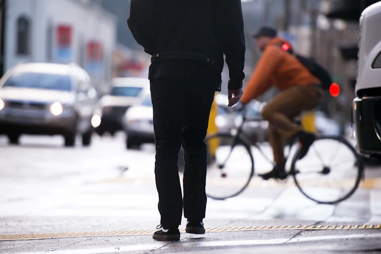 Pedestrian, cyclist and cars