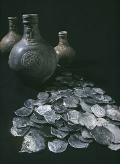 Artefacts recovered from the site of the Dutch vessel Vergulde Draeck include piles of silver coins.