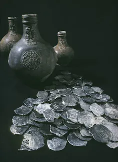 Artefacts recovered from the site of the Dutch vessel Vergulde Draeck include piles of silver coins.