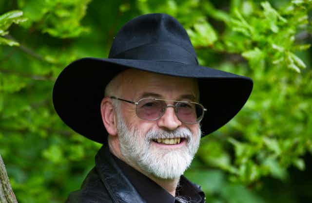 Terry Pratchett wearing a black fedora hat.