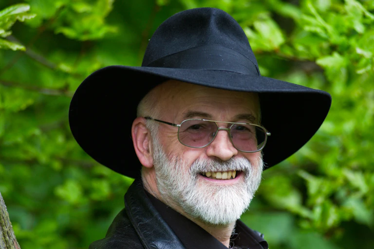 Terry Pratchett wearing a black fedora hat.