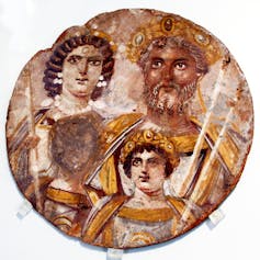 Round portrait of a roman family with oldest child's face destroyed.