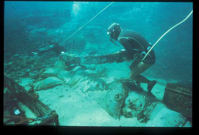 Divers at the site of the wreck of the Batavia, the flagship of the Dutch East India Company, which crashed into the coral reef surrounding the Wallabi Group of the Houtman Abrolhos islands off Western Australia in 1629