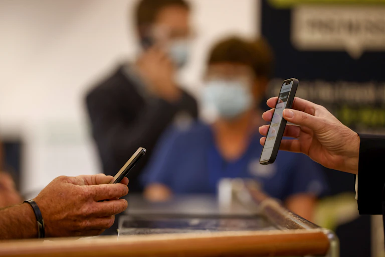 Person showing proof of vaccination on their phone