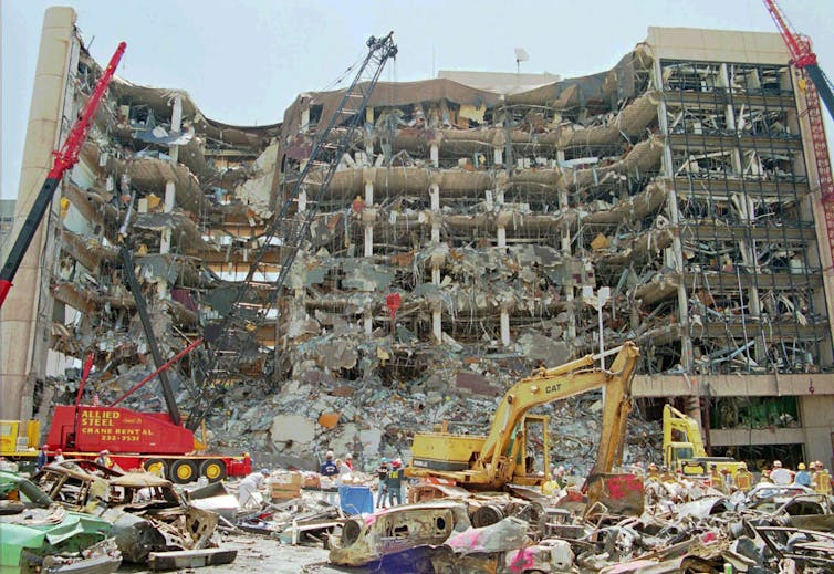The ruins of a multi-storey building, the front of it decimated by an explosion.