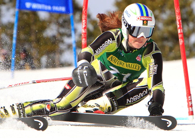 A skier angles around a gate