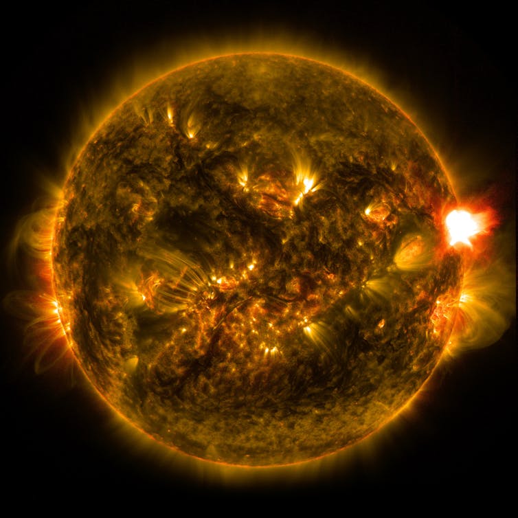 An image of the sun with a solar flare