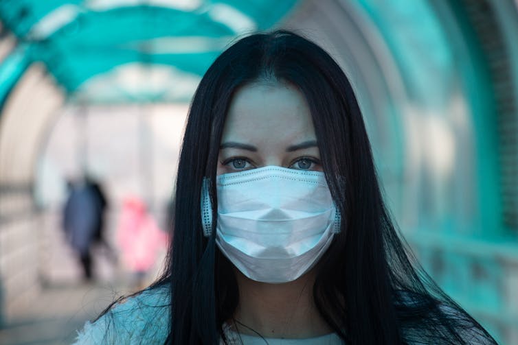 A person wearing a medical facemask