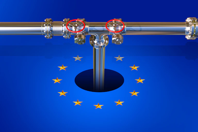 A metal pipeline descends into a hole within the EU flag.