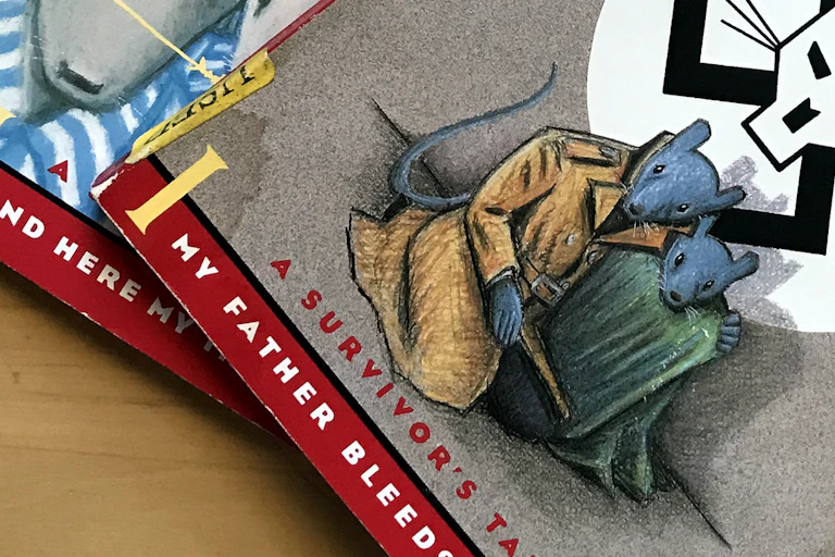 The front covers of two graphic novels showing illustrations of mice in internment uniforms and mice in traveling clothing, against the backdrop of a stylized swastika showing a cat face