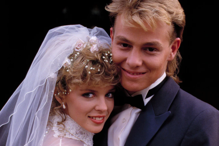 f Scott (right), played by Jason Donovan and Charlene, played by Kylie Minogue, tying the knot on Neighbours in the late 1980s