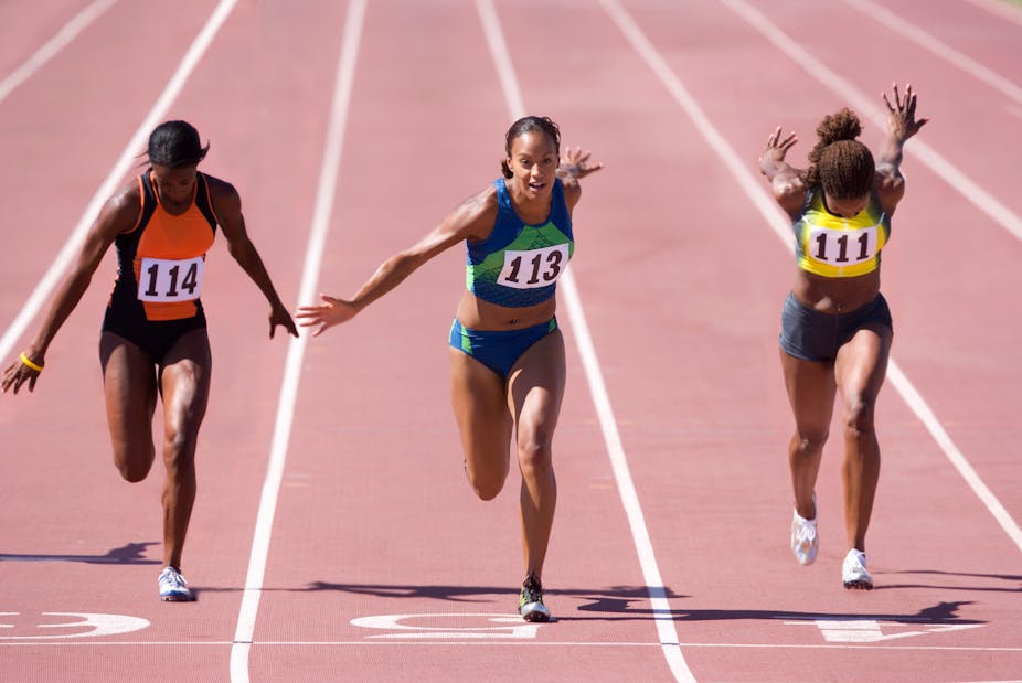 Three female sprints crossing the finish line.