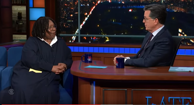 Whoopi Goldberg talks with Stephen Colbert on the set of his show