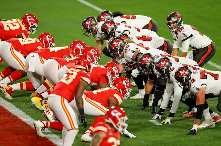 Players from the Tampa Bay Buccaneers and Kansas City Chiefs line up for a play in the Super Bowl