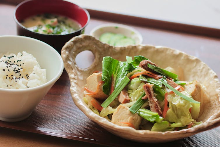 Healthy tofu stirfry with leafy greens.