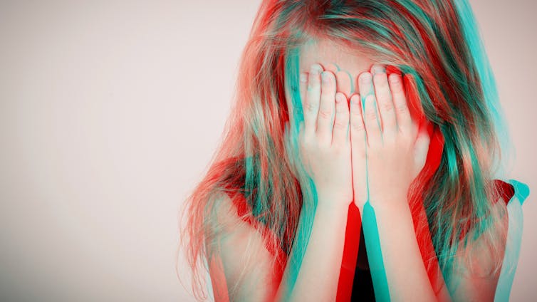 girl covers face. blurred effect.