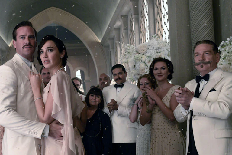 People at a wedding clapping the couple.