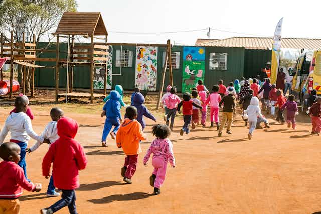 Preschool kids playing in the playground of a creche.