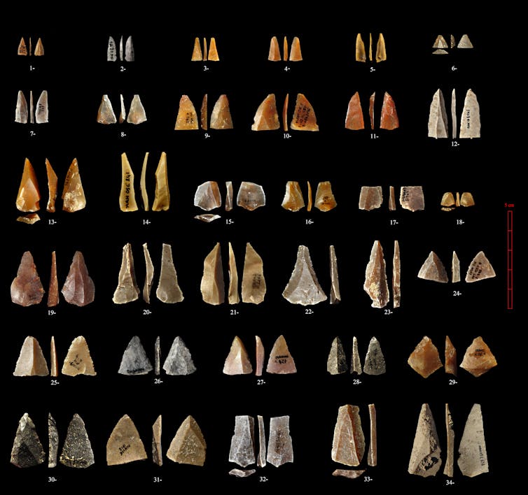 Triangular stone points against black background.