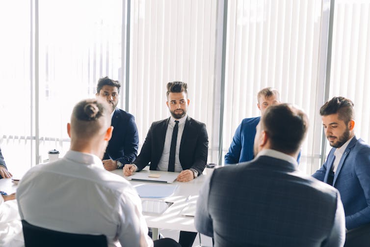 An all-male modern boardroom