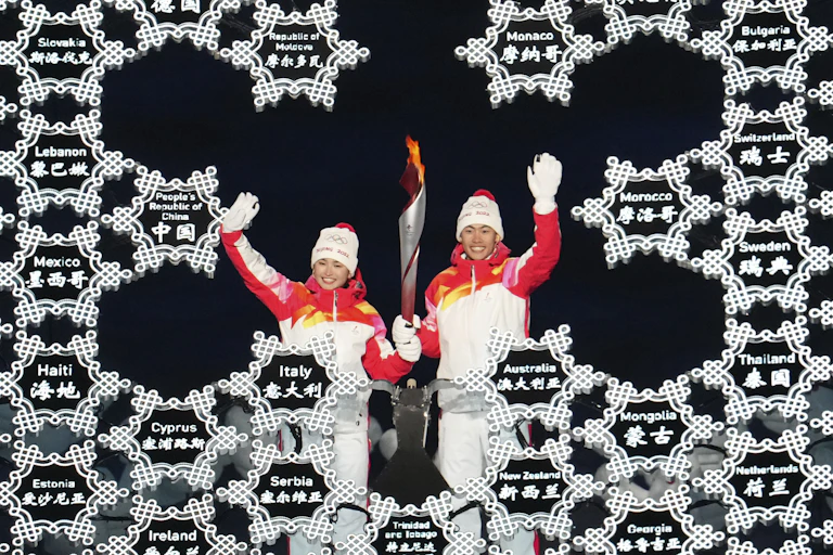 Chinese athletes lighting Olympic flame