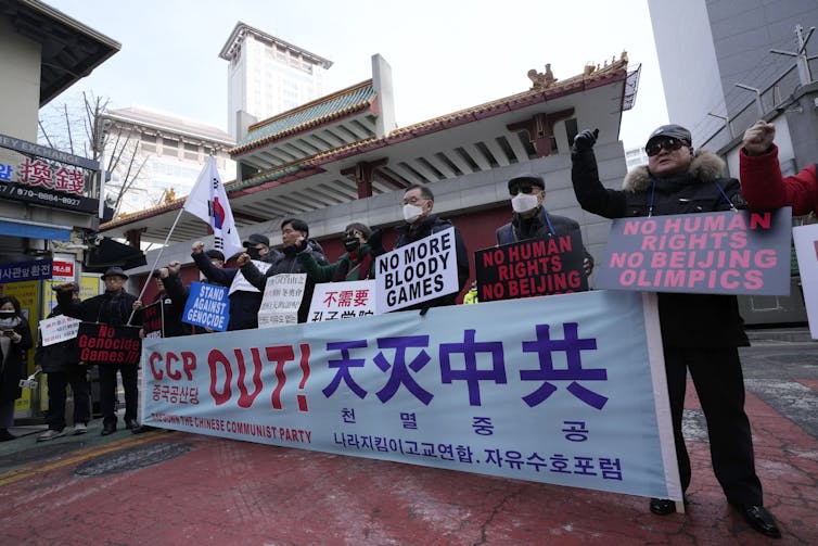 Protesters outside the Chinese embassy in Seoul.